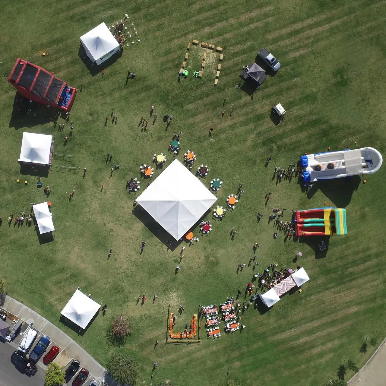 Aerial view of company picnic with tents, inflatables, tables, and dining area in Las Vegas