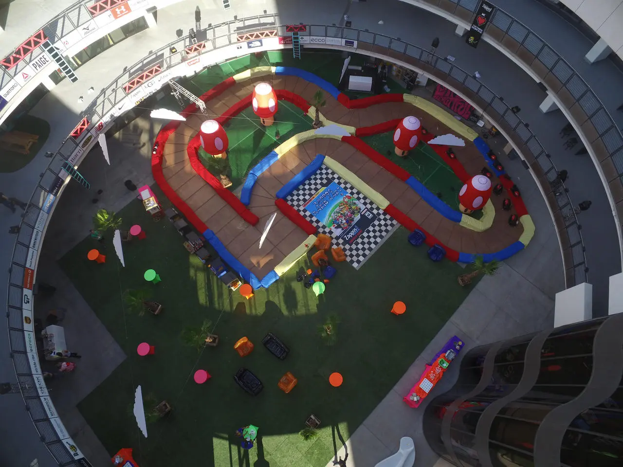 Aerial view of go-kart track event in circular plaza with artificial turf in Las Vegas