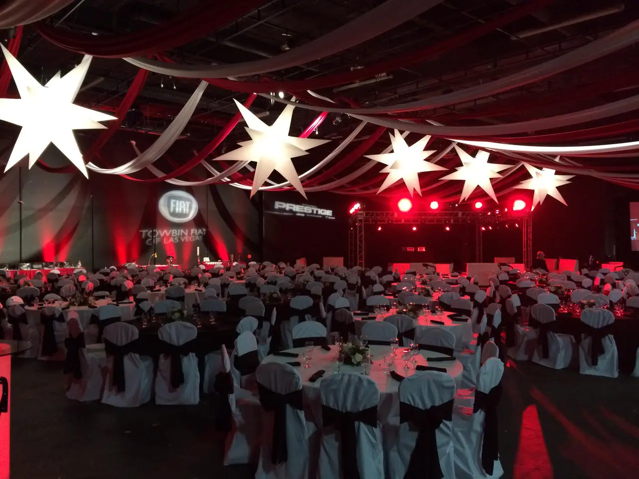 Towbin FIAT corporate gala with red and white decorations and star ceiling in Las Vegas