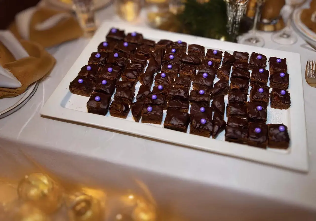 Chocolate brownies with purple candy pearls for dessert catering in Las Vegas