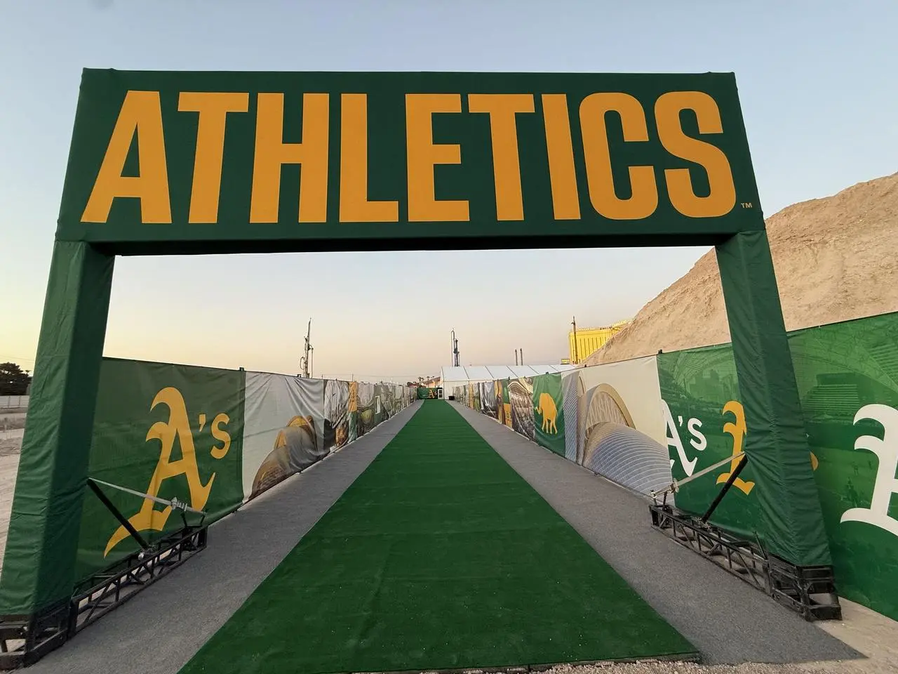 Oakland Athletics groundbreaking ceremony entrance arch with green carpet in Las Vegas