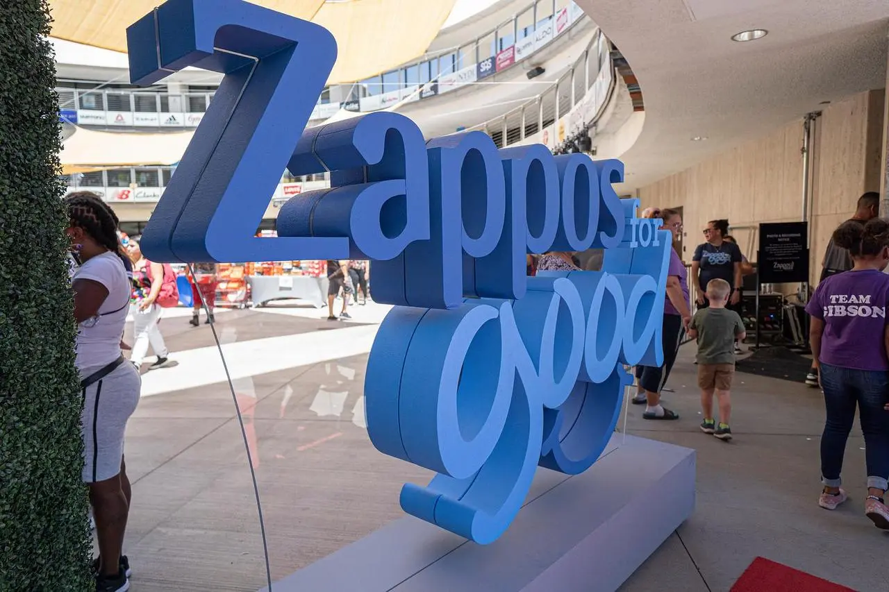 Zappos for Good outdoor event branding sign at stadium plaza in Las Vegas